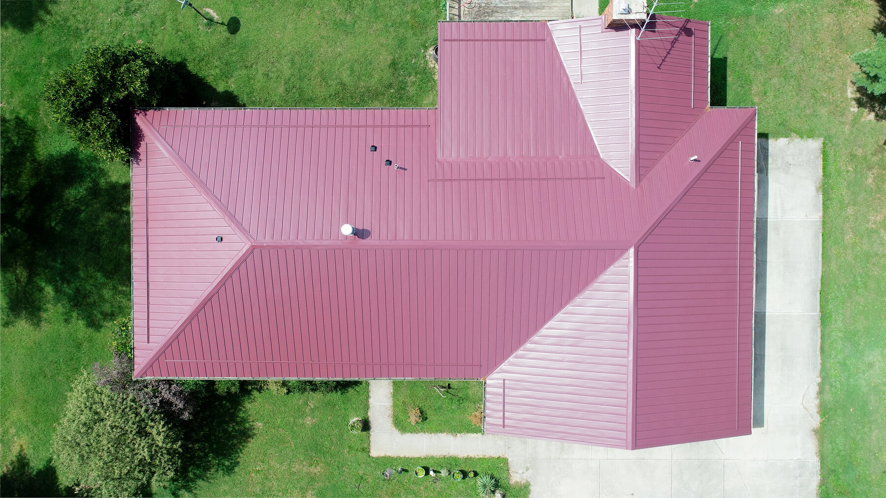 Aerial view of a burgundy metal roof on a Central Ohio home