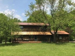 Copper-colored metal roof on a log home in Central Ohio