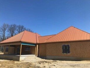 Copper-colored metal roof on a new construction home in Central Ohio