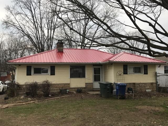Red metal roof on a ranch home in Central Ohio